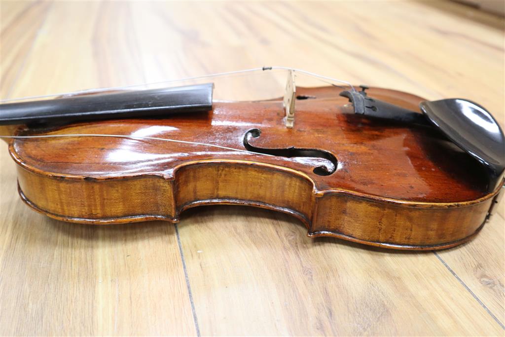 A 19th century Flemish? violin, length of back 35cm, cased with two bows
